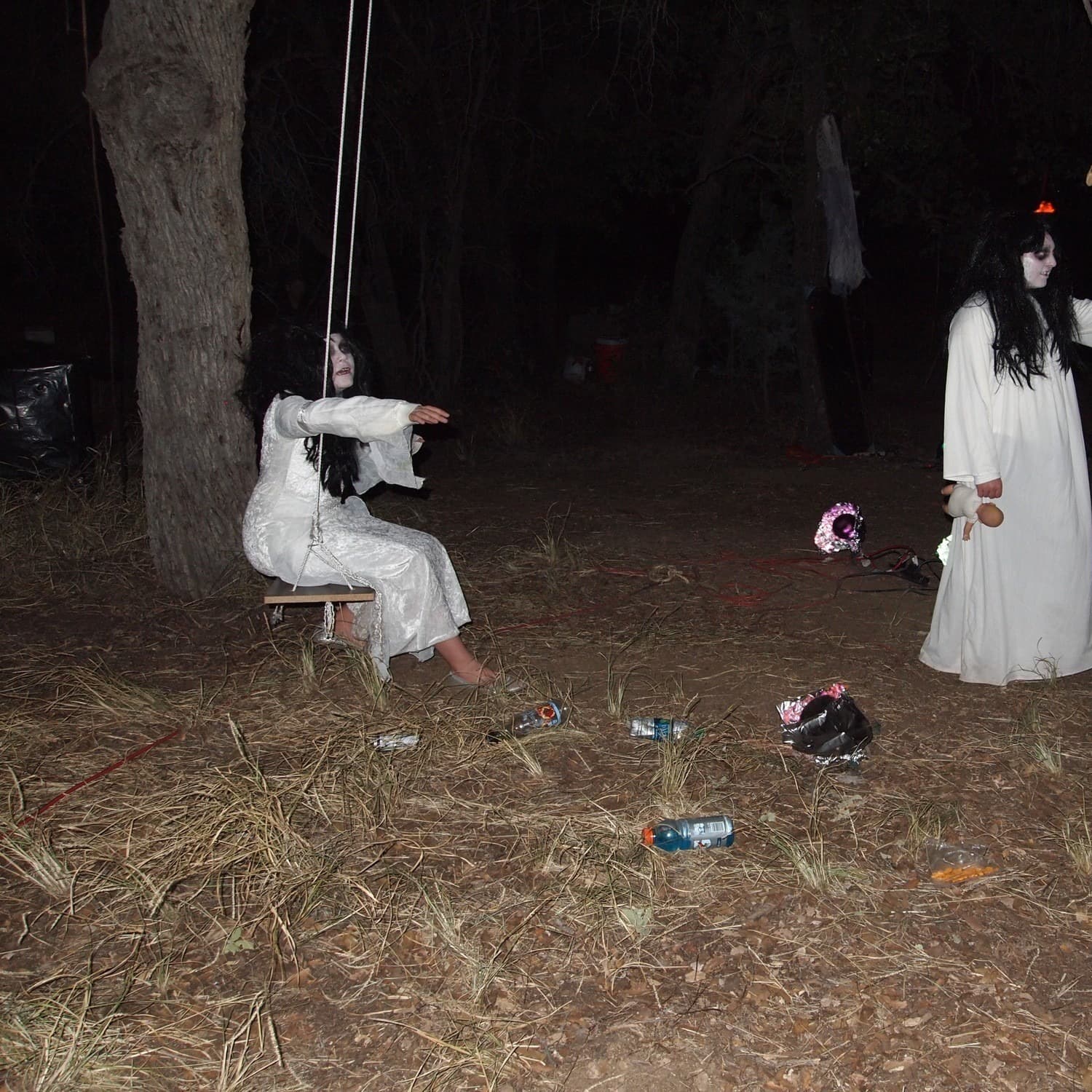 three women dressed in white gowns