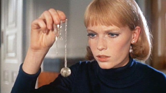 Rosemary holding up the necklace full of fungus