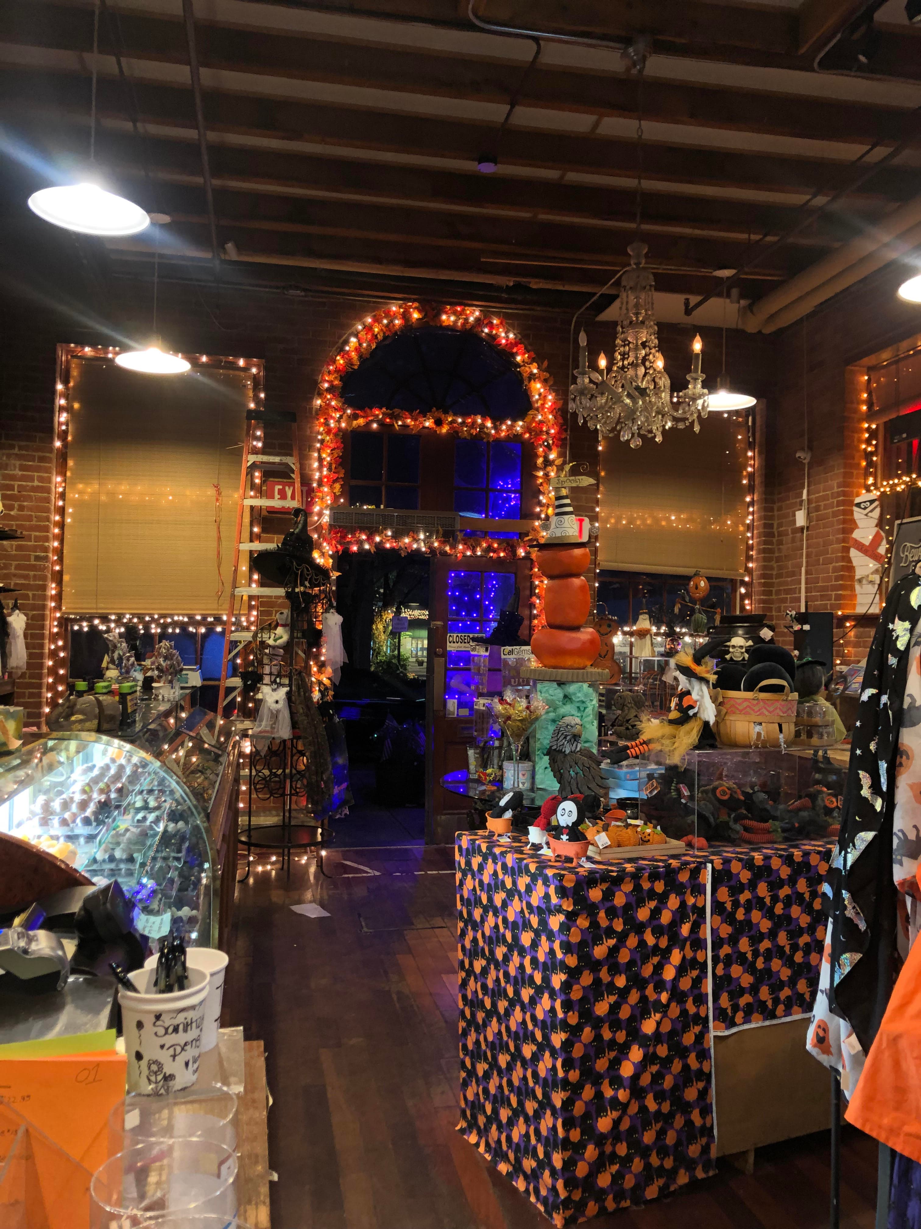 A candy store with purple and orange lights