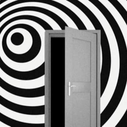 the door in front of a black swirling orb