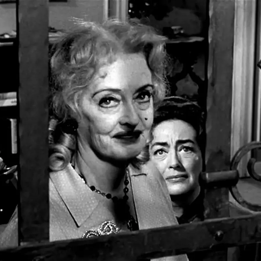 Picture of Baby Jane Hudson and Blanche Hudson looking out the window in fear